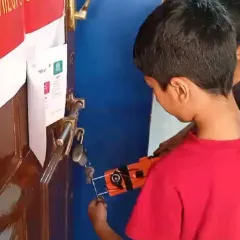 Putting the project to the test. After building his metal detector, this student is using it to find metal objects, seeing his creation work in the real world.