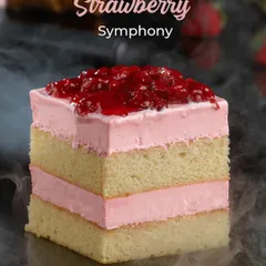This is my Strawberry Symphony pastry, a perfect harmony of light sponge cake and fresh strawberry cream. It's topped with a sweet strawberry compote, offering a burst of fruity flavour in every bite.