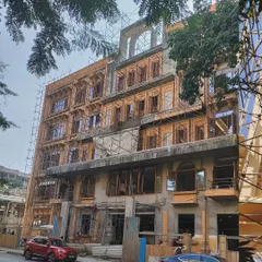 The Jain Upashray in Vile Parle under construction, with scaffolding surrounding its ornate facade. The design of this G+4 structure is inspired by the Five Great Vows of Jainism and the Sammed Shikharji Jain Temple.