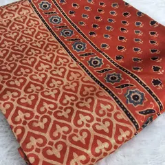 A beautiful piece of Ajrakh handblock printed modal fabric. The earthy red and beige tones, combined with the intricate geometric and floral patterns, make it perfect for a custom kurti or dupatta.