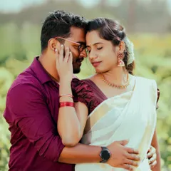 An intimate close-up of a couple sharing a tender moment. Dressed in traditional Kerala attire, this photo highlights the quiet beauty and deep connection we aim to capture in our couple portraits.