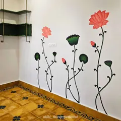 The lotus stems are painted to look as if they are growing up the wall, adding a sense of height and organic movement to this corner of the study.