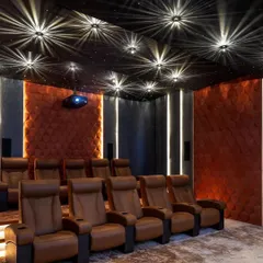 This is from our feature in Architectural Digest India on 'The Lux Casa'. The article highlighted the home's blend of modern amenities and nature, including this luxurious home theatre with its starlit ceiling.