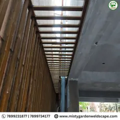 A strong and stylish safety grill installation in RR Nagar. This design uses vertical metal bars to provide maximum security for a narrow passage while allowing light and air to pass through.