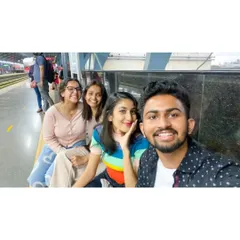 A selfie while waiting for the train on our way to a food exploration adventure.