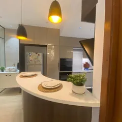 I design kitchens that are the heart of the home. This space features a modern breakfast bar, sleek cabinetry, and pendant lighting, combining functionality with high-end aesthetics.