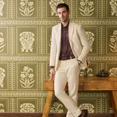 An ivory suit made from 100% Irish Linen, paired with a patterned shirt for a relaxed yet sophisticated look. This ensemble is ideal for warm climates and daytime celebrations.