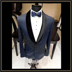 This navy blue tuxedo makes a bold statement with heavy, sparkling embroidery across the lapel and sleeves. It's a perfect choice for a glamorous reception or cocktail party.
