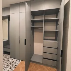 A look inside one of my custom wardrobes, showing the organized layout with hanging rods, shelves, and a bank of smooth-pulling drawers for smaller items.