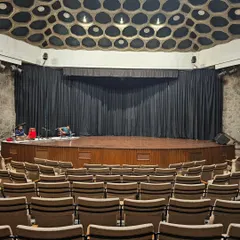 The view from the audience before a performance at IIC New Delhi. This is the calm before the storm, a moment of anticipation as we prepare backstage.