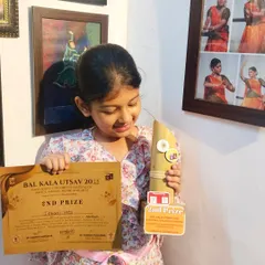 My student Ishani, beaming with joy as she holds her certificate and trophy for winning Second Prize at the Bal Kala Utsav. Guiding young dancers on their journey is a deeply fulfilling part of my work.