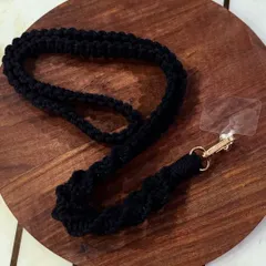 A classic black lanyard with a spiral knot design. It's simple, strong, and goes with everything.