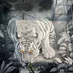 The full view of the white tiger mural at a private clubhouse. This piece makes a dramatic statement at the entrance, showcasing our skill in realistic animal portraiture.