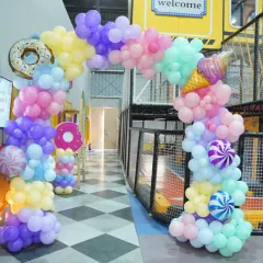A sweet Candyland theme! This party features donut and ice cream balloons, a pastel color palette, and candy-striped details for a truly delicious celebration.