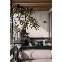 A quiet moment on the master bedroom deck. We designed this built-in bench to be a private space for reflection, surrounded by greenery and the open sky. It’s these small, personal nooks that transform a house into a home.