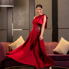 For evening wear, I focus on capturing movement and glamour. This studio shot uses precise lighting to showcase the flow and form of the gown, creating a dramatic and elegant image ideal for designer collections.