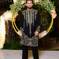 Our client looking sharp and ready for a celebration in our black and gold embroidered kurta. It's a timeless piece that guarantees a memorable impression.