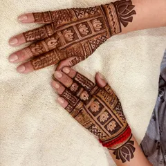 This back-of-hand design combines a Madhubani-style lotus cuff with a detailed grid pattern on the fingers. It’s a beautiful example of how I mix different traditional art forms in my work.