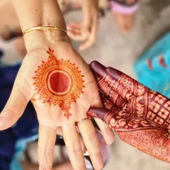 I love showing the two key stages of a natural henna stain. On the left is the fresh, bright orange color you see right after removing the paste, and on the right is the gorgeous deep stain from my own hand, developed after 48 hours.