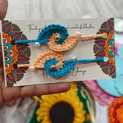 A close-up of my crochet rakhis, designed to be cute, colorful, and full of charm. These are reusable and made with so much love.