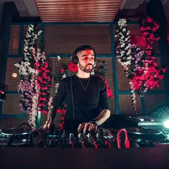 In the zone. This is me locked in, reading the crowd and mixing tracks to create the perfect atmosphere. It's all about focus and feeling the music.