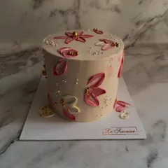 This cake is a piece of edible art, featuring delicate pink flowers created with a palette knife painting technique. Inside is my popular Coffee Chocolate flavor.