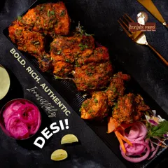 Our Tandoori Chicken is a classic for a reason. We marinate the chicken in a blend of traditional spices and yoghurt, then cook it in the intense heat of a clay tandoor. The result is juicy, smoky, and irresistibly delicious.