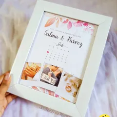 Celebrate your special date with a personalized calendar frame. This design combines your favorite photos with a calendar marking your engagement or anniversary, creating a timeless keepsake of your love story.