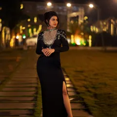 Capturing the perfect moment under the lights. This outdoor evening shot of actress Sanjanaa Anand shows my approach to event and lifestyle photography, using ambient lighting to create a moody and elegant portrait.