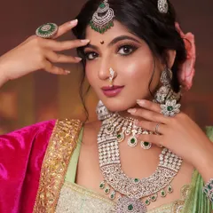 Embodying the spirit of a regal Maharashtrian queen. This look features intricate diamond and emerald jewelry, including a statement necklace and maang tikka, perfectly complementing the rich Peshwai-style attire for a powerful character portrayal.