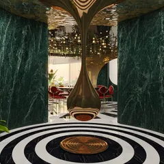A glimpse into our 'Whimsy Wonder' project, a maximalist experience center where art and luxury collide. Here, green marble, bold patterns, and a dramatic central sculpture create a wonderland of playful opulence.