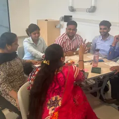 A group of educators working together during a training session. My workshops emphasize peer learning and discussion, creating a supportive environment where teachers can share ideas and solve problems collectively.