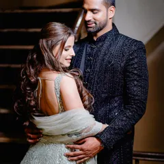 A portrait of the couple in their elegant engagement attire. The focus is on their connection and the beautiful details of their outfits, capturing the glamour of the occasion.