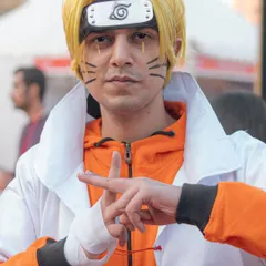 A cosplayer in full Naruto Sage Mode attire, making a classic hand sign for a jutsu. I work with cosplayers to get poses that are true to their characters.
