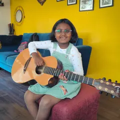 Capturing pure joy and musical bliss as a young student enjoys our summer camp. It's all about making fun musical memories.