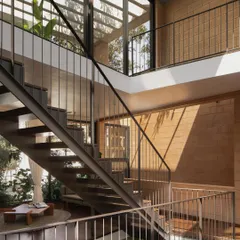 Another view of the open staircase in the Debris Block House. The design creates visual connections between floors and draws the eye upwards, making the entire home feel interconnected and filled with light.