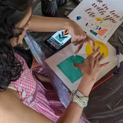 A participant working on a modern calligraphy piece during one of our packed Sunday events. It's a beautiful skill that combines art and lettering.