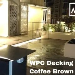 Another view of the coffee brown WPC decking project, showing how the integrated lighting strip follows the clean lines of the planters and seating, highlighting the layout of the space after dark.
