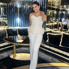 The full look, showing how the makeup and hair come together with her stylish outfit for a perfect anniversary celebration.