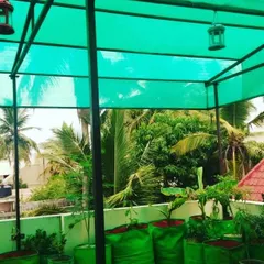Protecting your plants from intense sun is crucial, especially on a terrace. I install green shade netting on a sturdy frame, which filters the sunlight and keeps your plants from getting scorched.