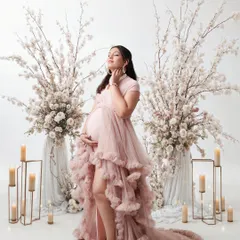 This is for the mom who wants a truly dreamy and elegant maternity session. We created a fairytale setting with flowing gowns, soft candlelight, and beautiful floral arrangements to celebrate her journey to motherhood.