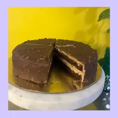 A look inside my Almond Rocher cake. You can see the crunchy almond layers enveloping a rich, velvety center. Each slice is a celebration of decadence and texture.