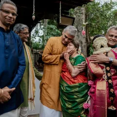 An emotional moment as the bride is embraced by her family. These are the priceless, candid memories that we are honored to capture.