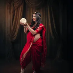 I believe a mother holds the universe within her. This fine art portrait blends tradition with a touch of the divine, using the glowing moon to represent the radiant life she nurtures.
