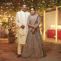 Because parents deserve to look their best too. This couple, the parents of the bride or groom, look elegant and coordinated in their rented outfits.