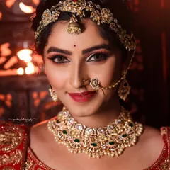 A series of portraits showcasing a model in a heavily embroidered red bridal lehenga. I focused on capturing the intricate details of the outfit and the flawless bridal makeup, presenting a look of regal elegance.