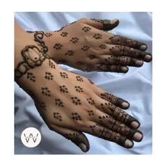 A minimalist design with a lotus bracelet and delicate leafy patterns on the back of the hand.