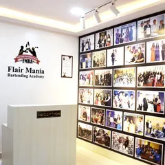 The reception area of one of our academies, featuring a wall of fame with photos of our successful students and memorable moments.