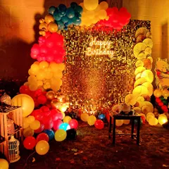 A closer look at the Winnie the Pooh themed birthday backdrop. The combination of the gold sequin panel, neon sign, and a classic Pooh bear cutout makes for a timeless and heartwarming party setting.