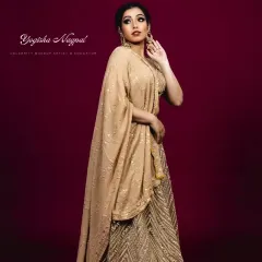 Golden glam for a designer brand's shoot. This regal look, with its soft glam makeup and glowing skin, was created to complement the luxurious golden lehenga.